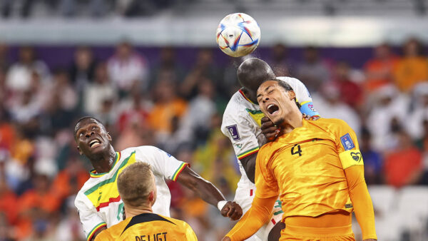 (221121) DOHA, Nov. 21, 2022 Virgil van Dijk (1st R) of the Netherlands heads the ball with Kalidou Koulibaly (2st